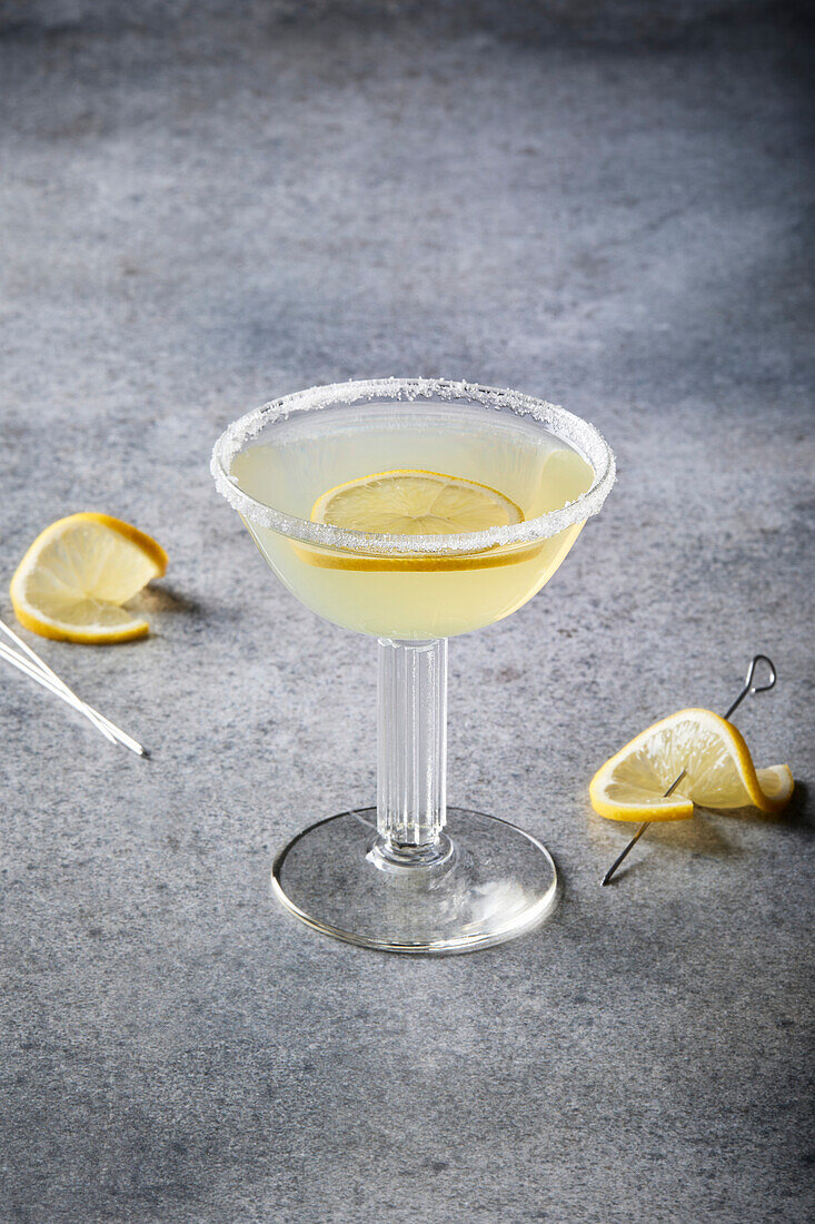 Lemon cocktail on a grey background