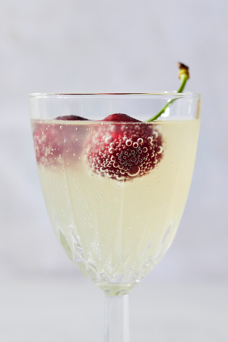 Lemon sparkling water with cherries