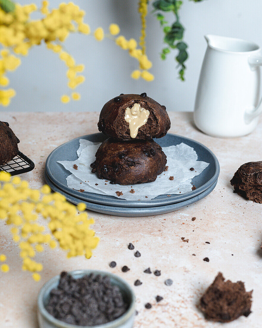 Chocolate bread with tahini spread on a table with yellow flowers