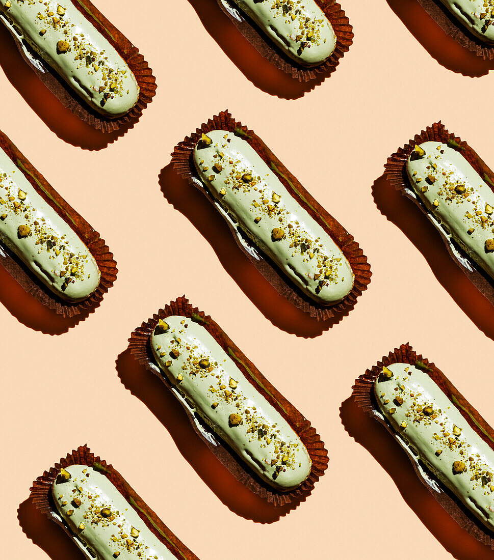 Pistachio eclair on a pink background pattern