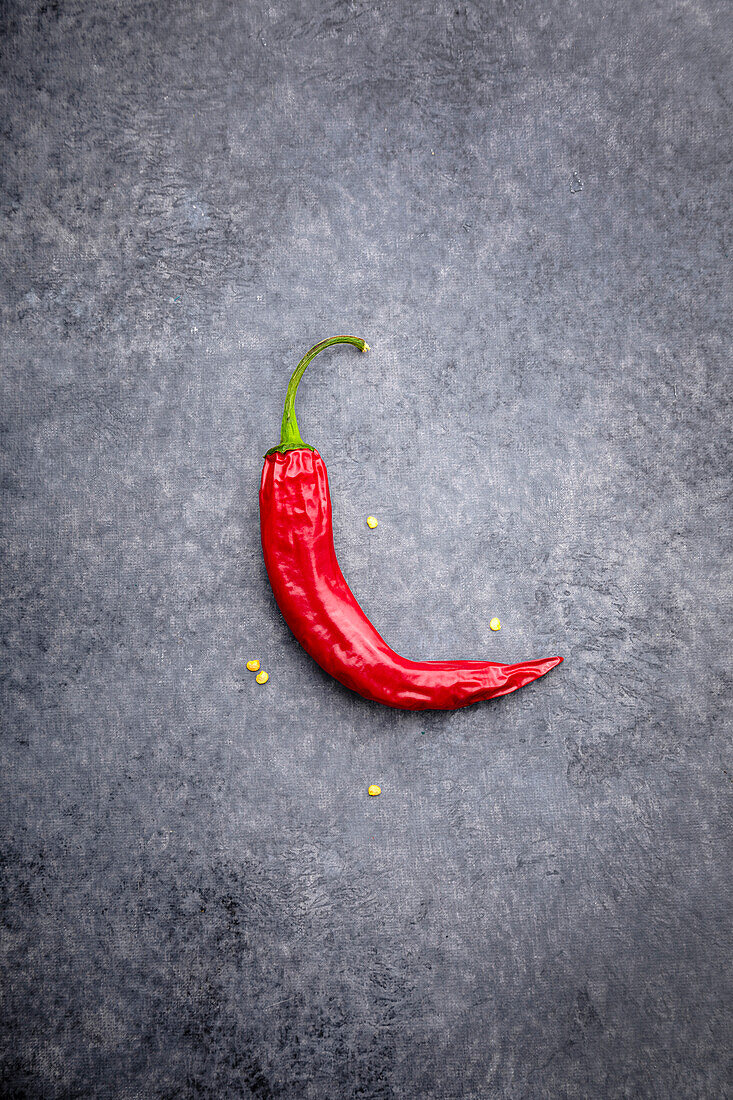 A chilli pepper on a grey background