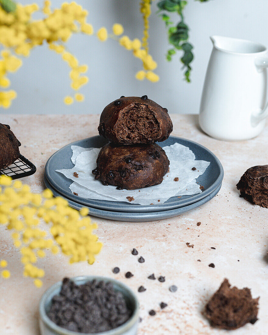 Chocolate bread with tahini spread on a table with yellow flowers