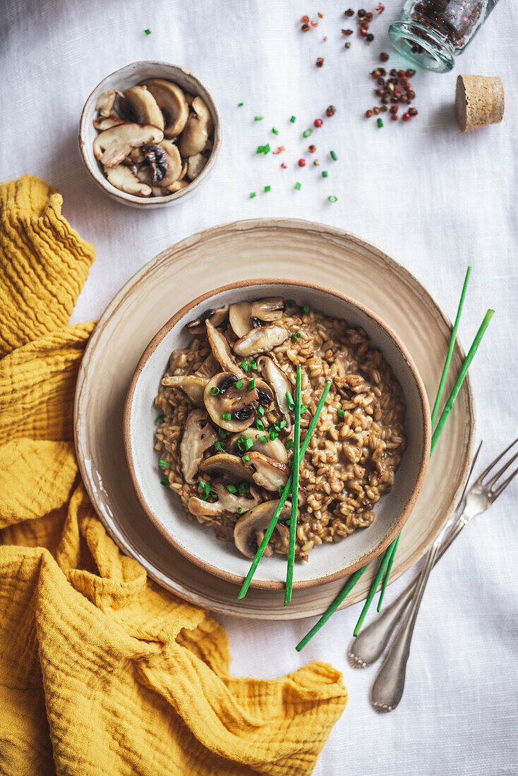 Oatmeal and mushroom risotto in a ceramic bowl