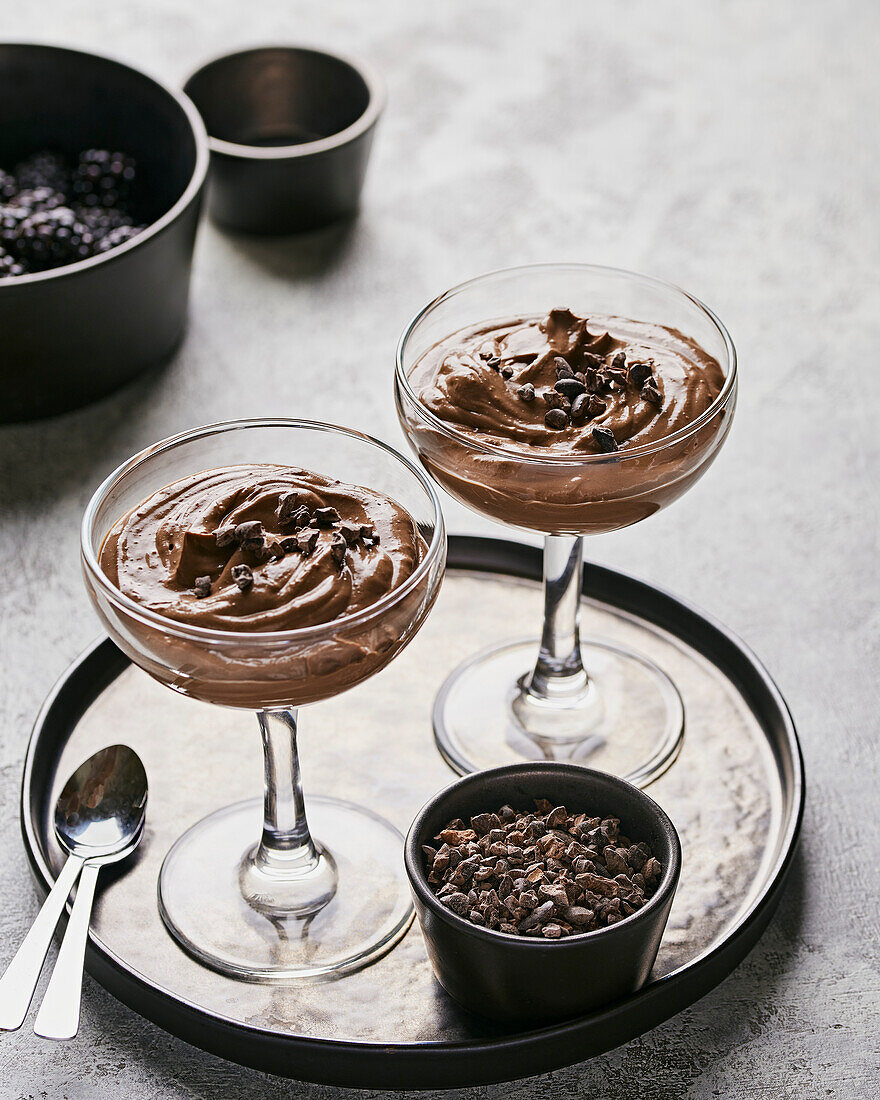Two glasses of chocolate tofu peanut butter mousse