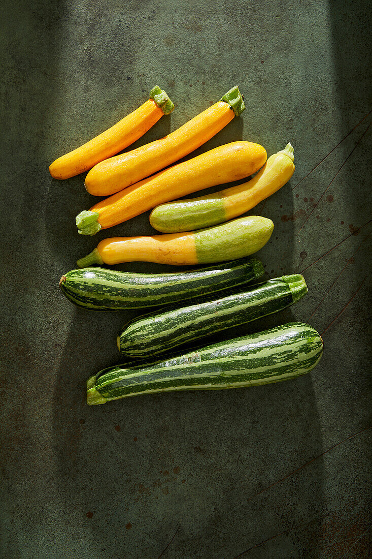 Courgettes on a green background
