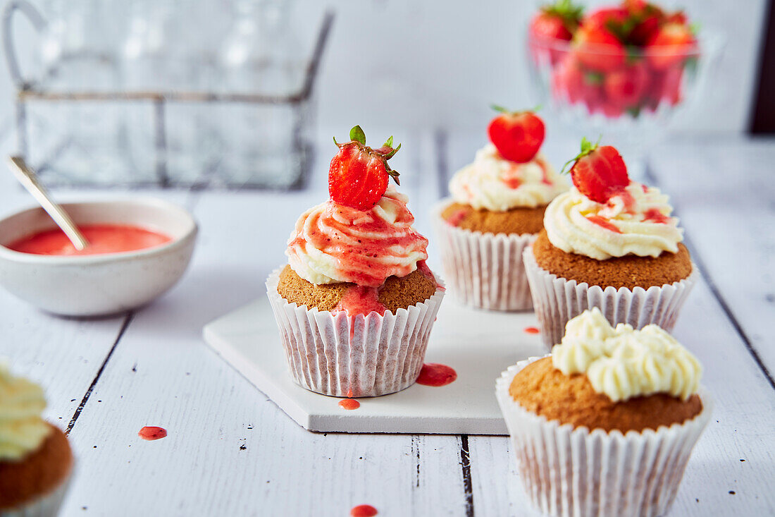 Strawberry cupcakes with cream cheese icing and coulis