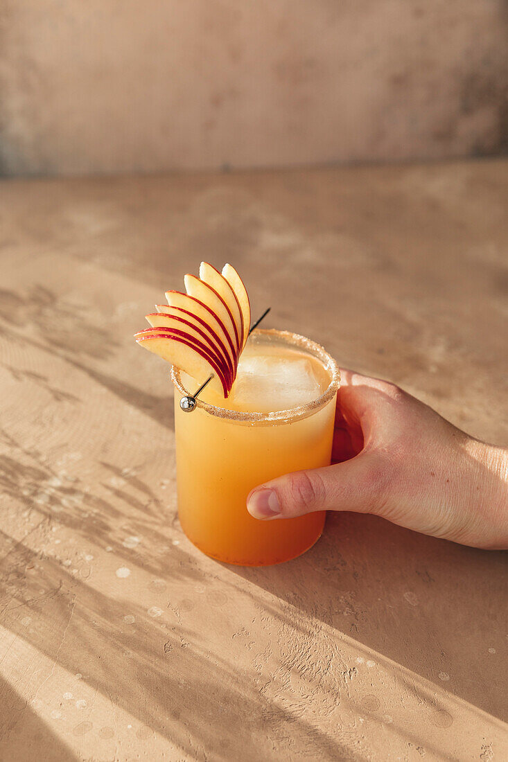 Spiced apple drink garnished with sliced apple