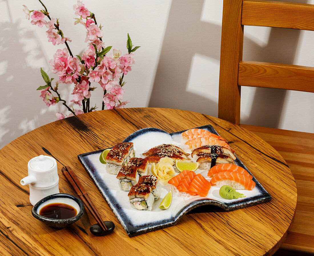 Sashimi and nigiri sushi on a wooden table