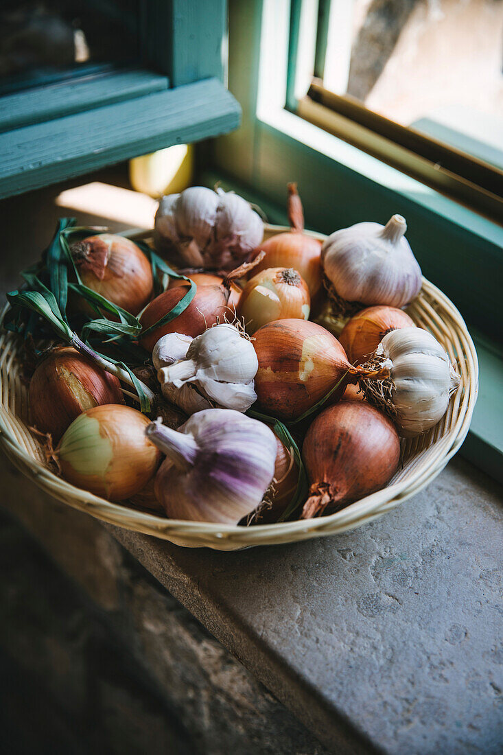 Onions and garlic in a basket