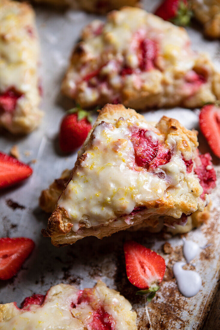 Strawberry and cream cheese scones on a baking tray