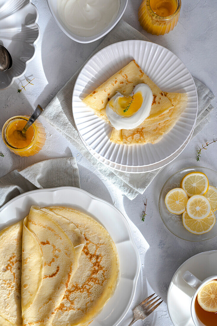 Crepes with whipped cream, lemon curd and thyme