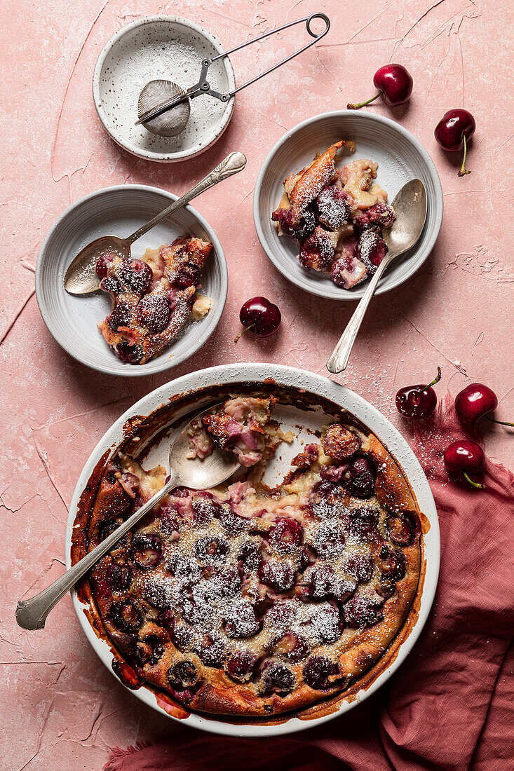 Cherry clafoutis on a pink background