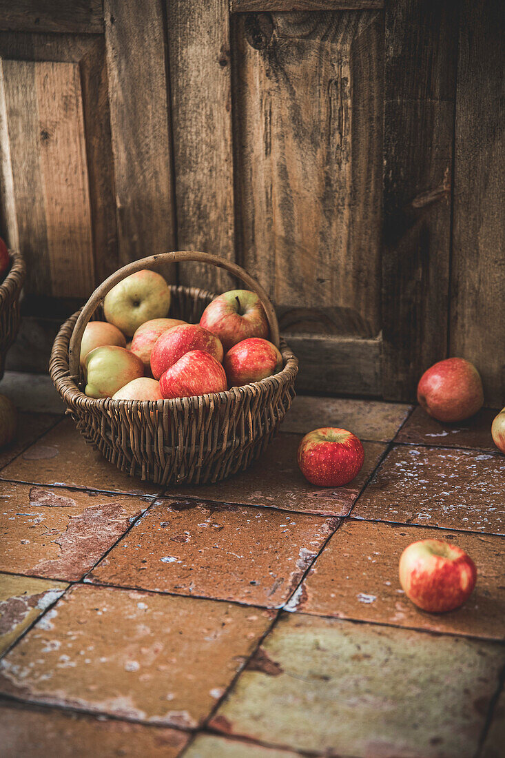 Ripe apples in a basket in a kitchen
