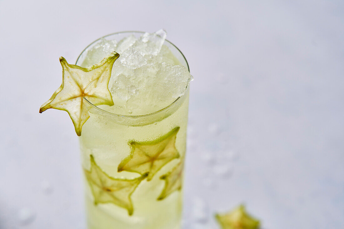 Starfruit cocktail drink with ice