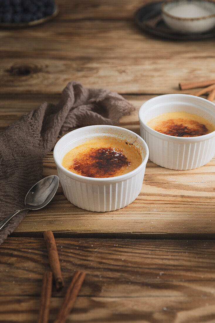 Crema Catalana Spanish custard on a wooden kitchen plate