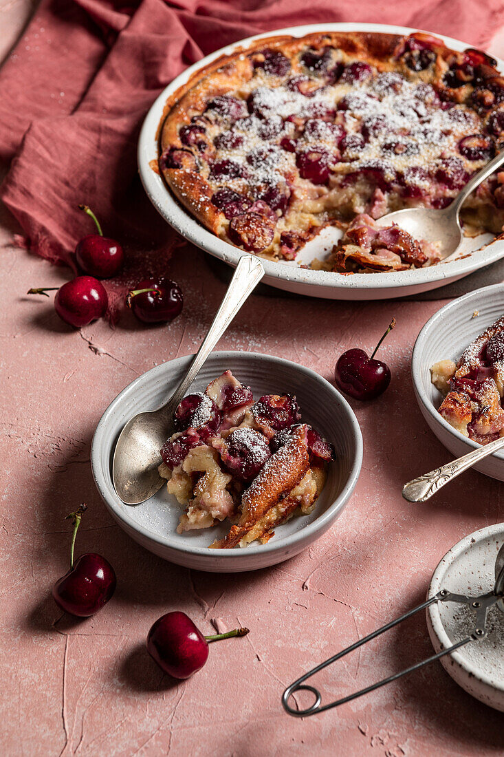 Cherry clafoutis on a pink background