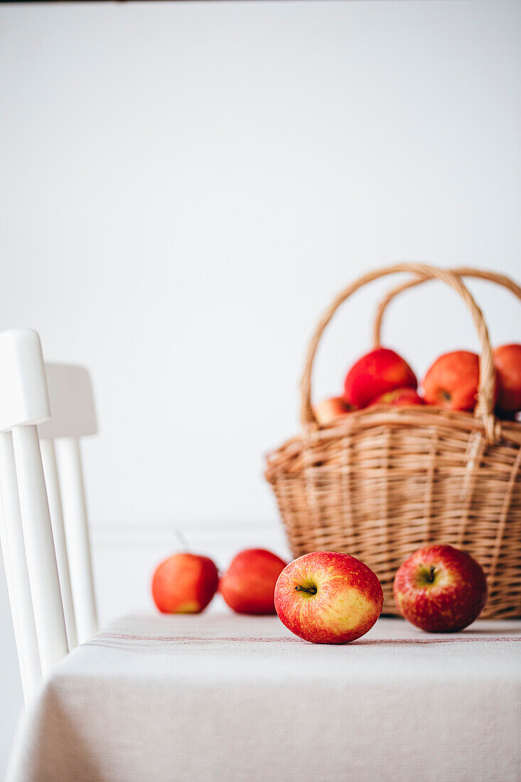 Apples in a basket against a white background