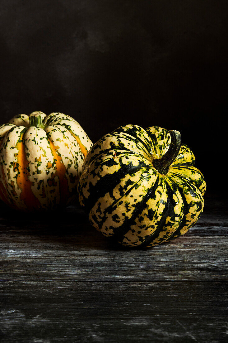 Pumpkin portrait on a dark surface and background