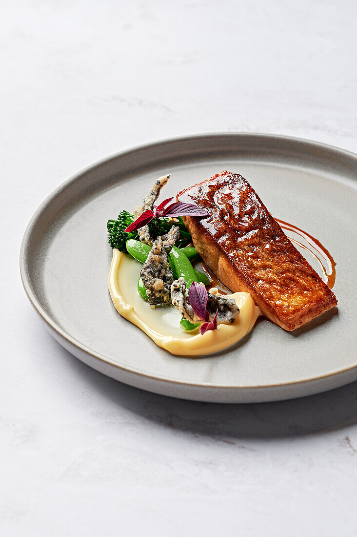 Salmon fillet glazed with miso, cauliflower puree, sugar snaps, broccolini, crispy nori