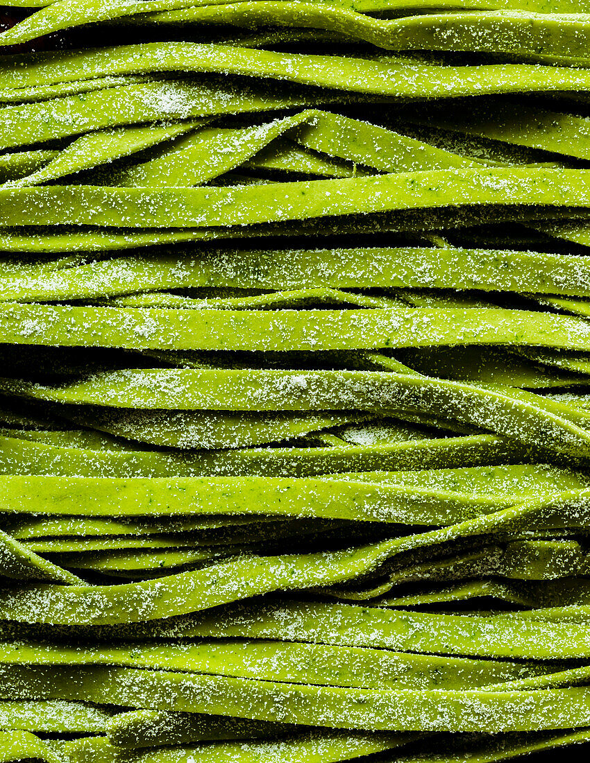 Green spinach tagliatelle pattern background