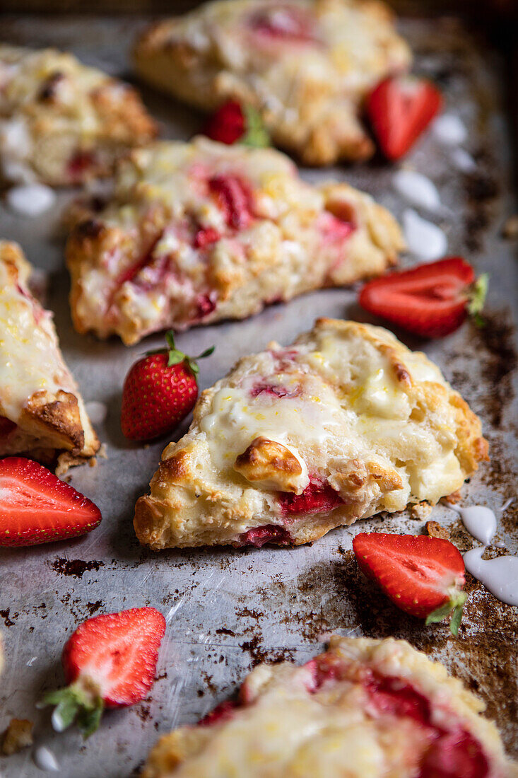 Strawberry and cream cheese scones on a baking tray