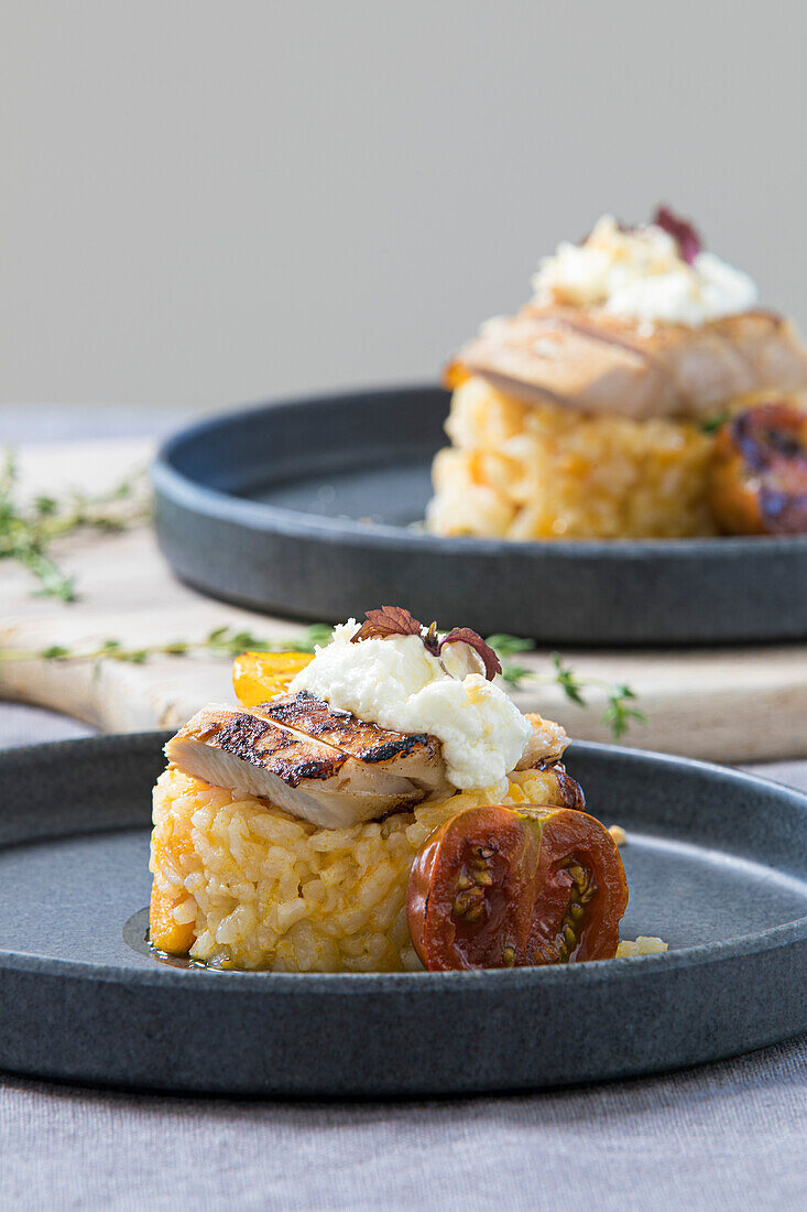 Pork tenderloin on a sage risotto with pumpkin,goat cheese and hazelnuts