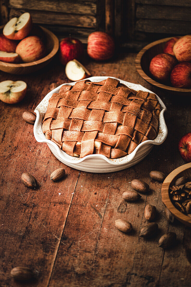 Lattice-shaped apple pie on a wooden table