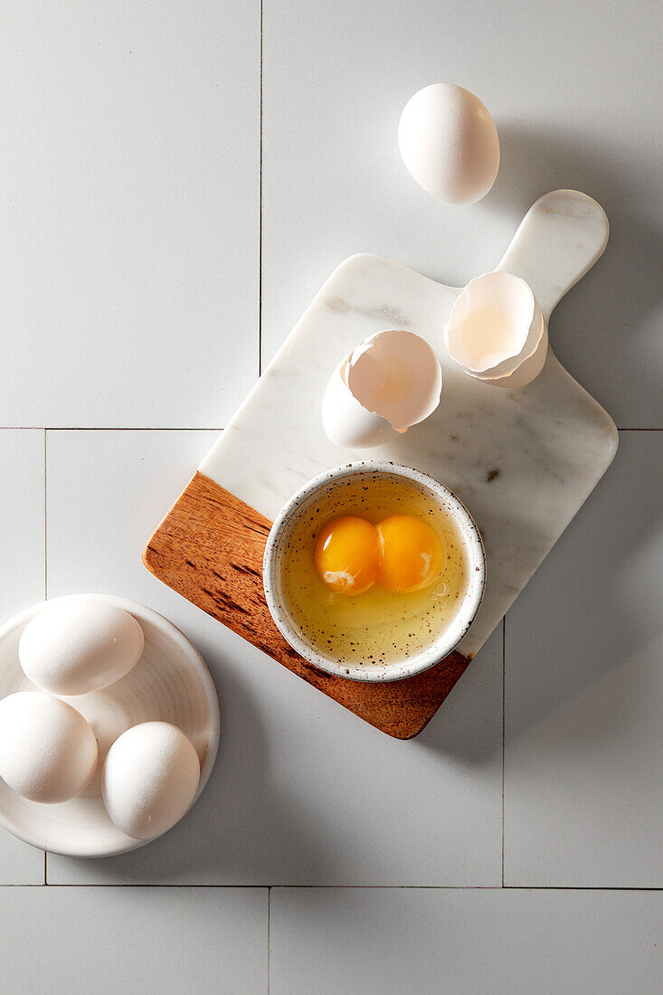 Egg with double yolk whipped in a small bowl