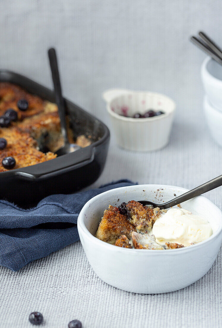 Banana bread and butter pudding and ice cream in a bowl