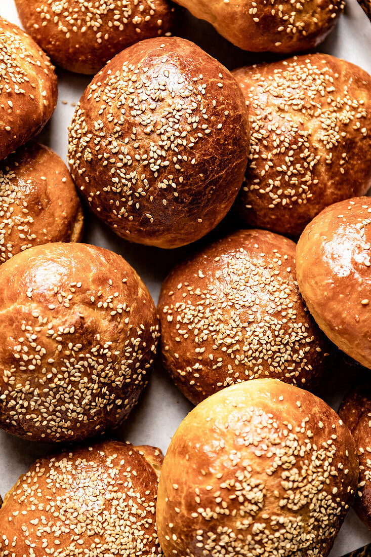 Fresh homemade brioche buns with sesame topping