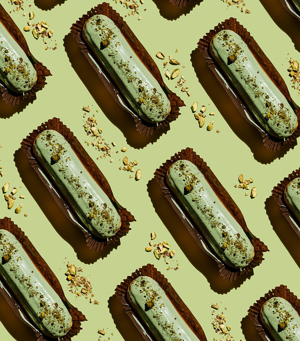 Pistachio eclair on green background pattern