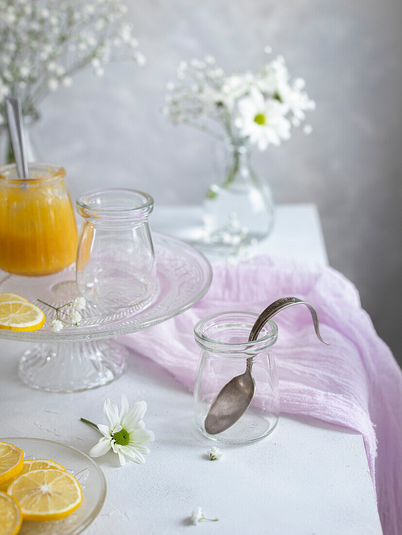 Lemon curd in glass jars. Soft romantic scene.