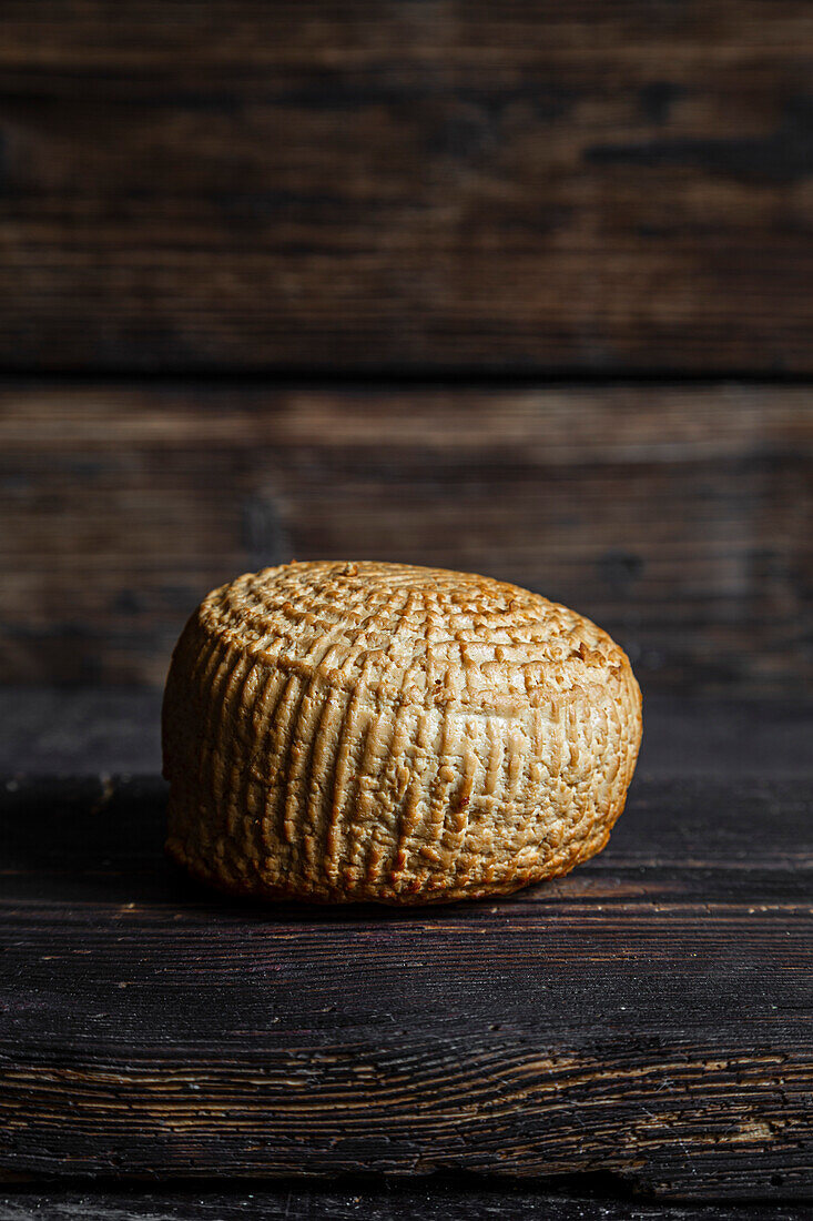 Smoked cheese on a dark background with blanks