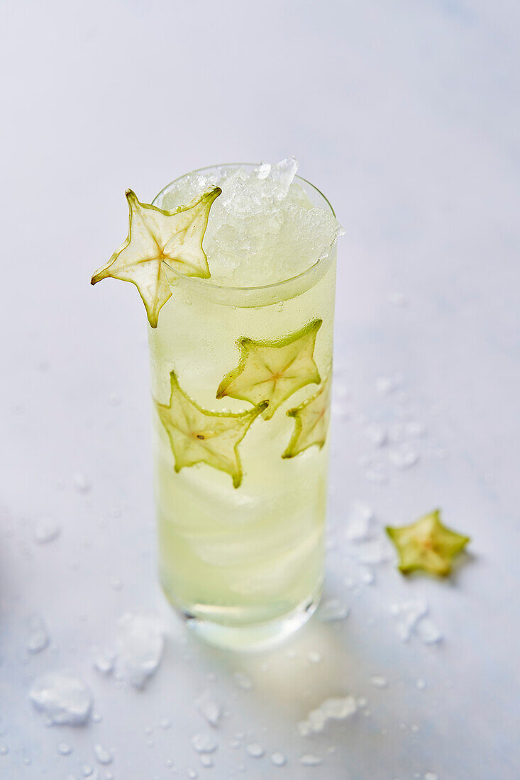 Starfruit cocktail drink with ice