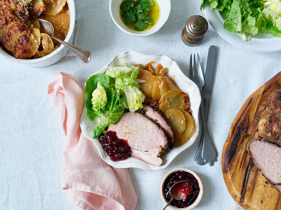 Dinner of slow-roasted pork, potatoes and salad
