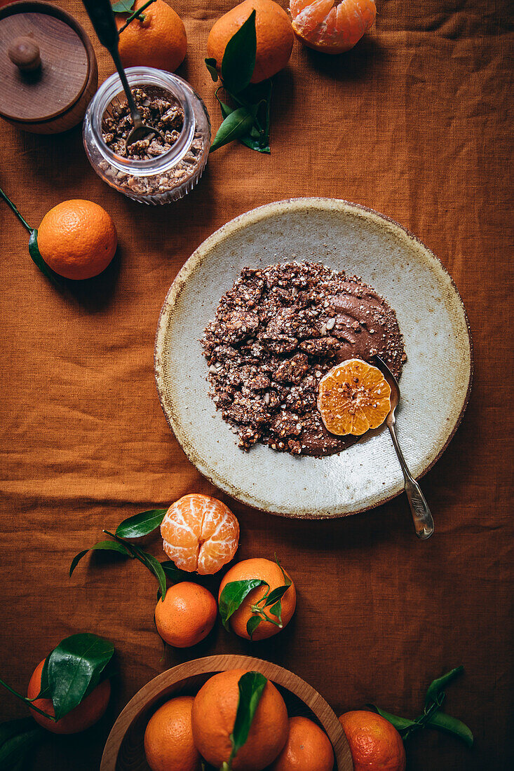 Chocolate mousse and orange with homemade chocolate granola