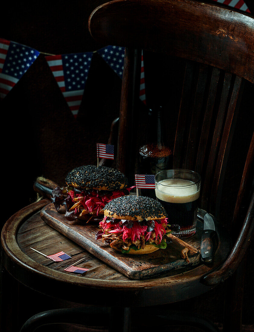 Pulled pork burger with black sesame seeds with crispy apple salad, pickled red cabbage, crispy apple salad, American flag, USA Independence Day