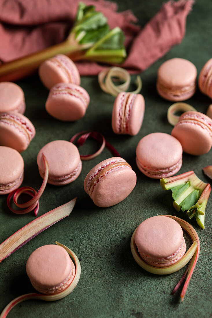 Rhubarb macarons on a green background