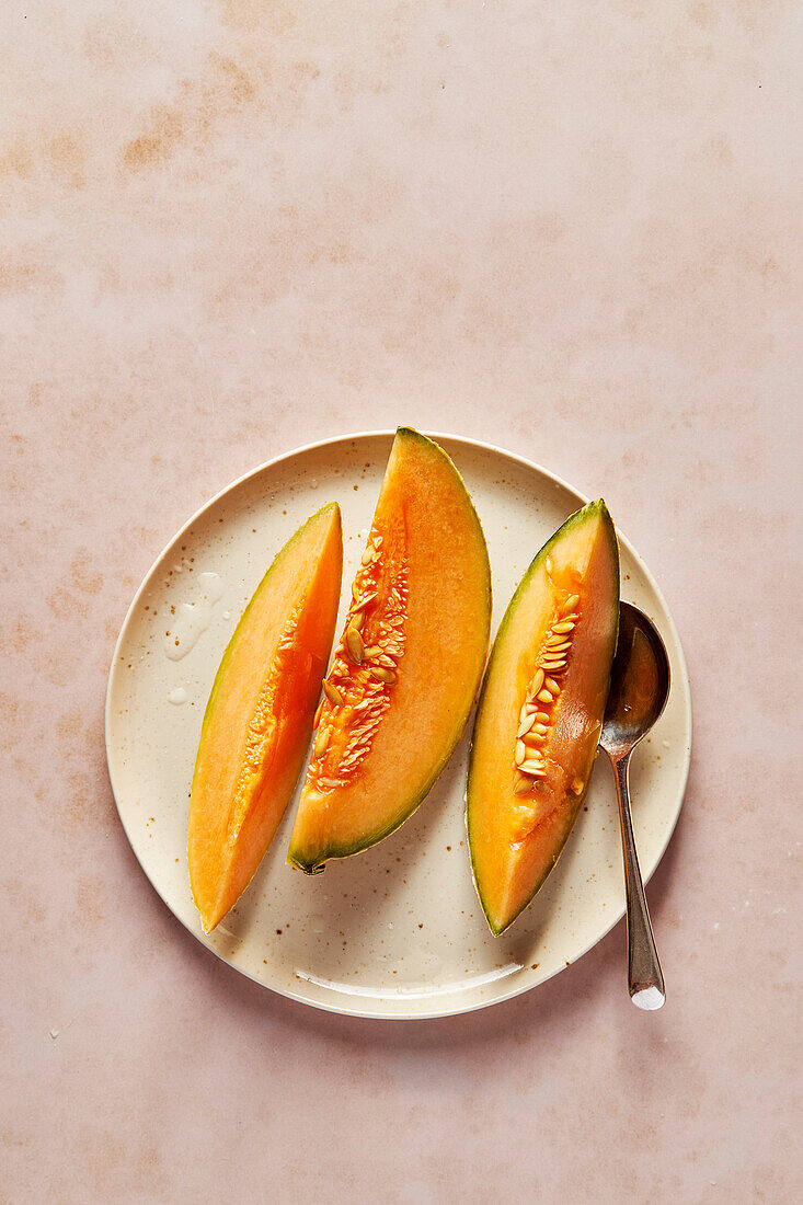 Cantaloupe melon slices on plates