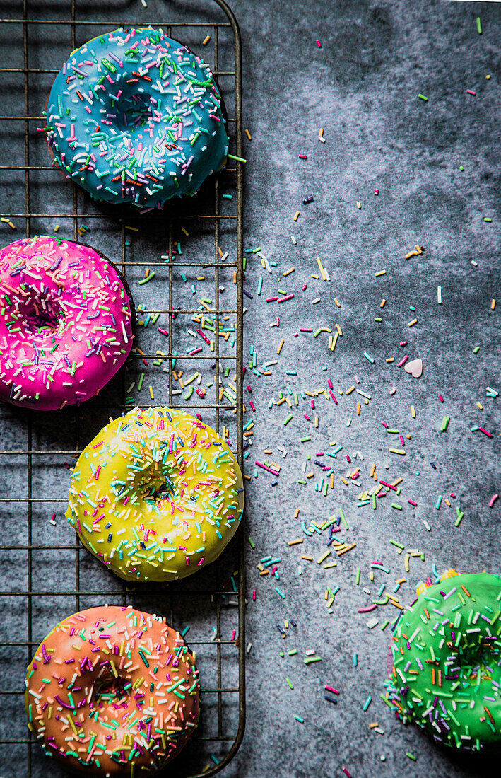 Colorful donuts on a cooling tray