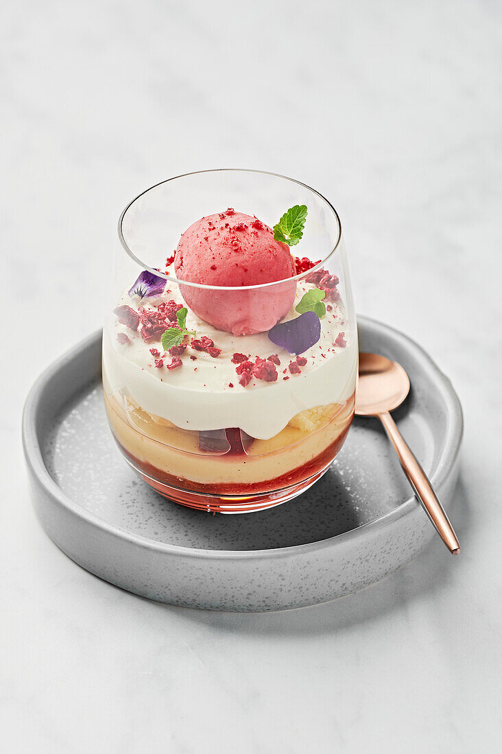 Trifle with rhubarb compote, vanilla custard, raspberry gel, Victoria sponge, chantilly cream, raspberry sorbet