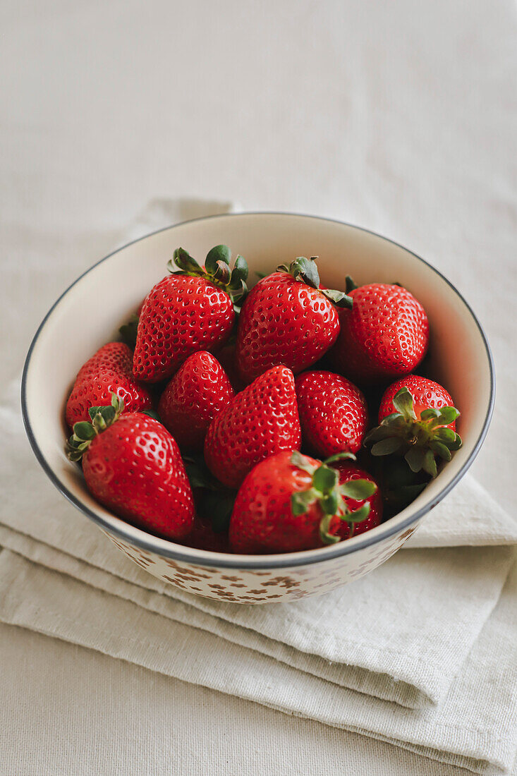 Bowl of strawberries on a napkin