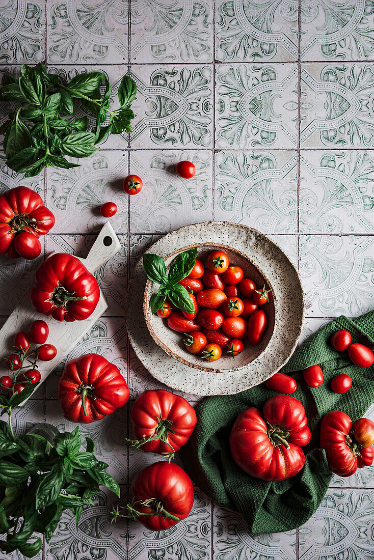 Selection of home-grown tomatoes on antique tiles