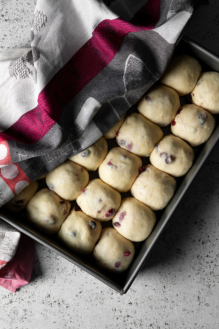 Cranberry Hot Cross Buns in a baking tray