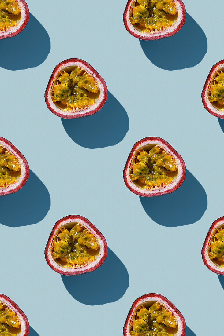 Vertical Pattern of Tropical exotic Passion Fruit on blue background flatlay food