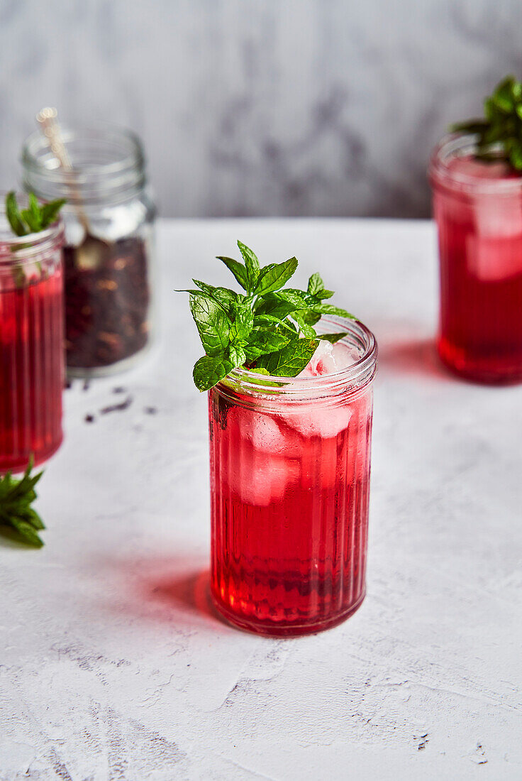 Iced hibiscus tea with mint garnish