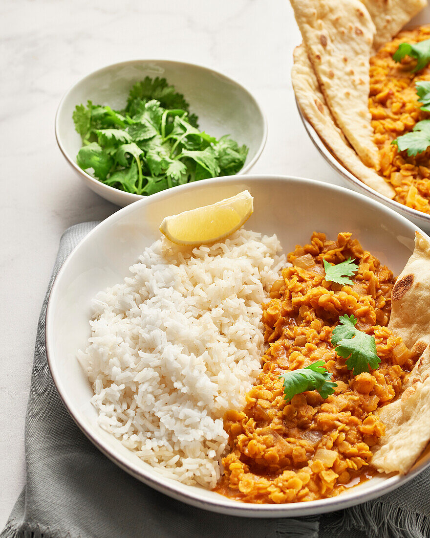 Bowl with red lentil dahl and basmati rice