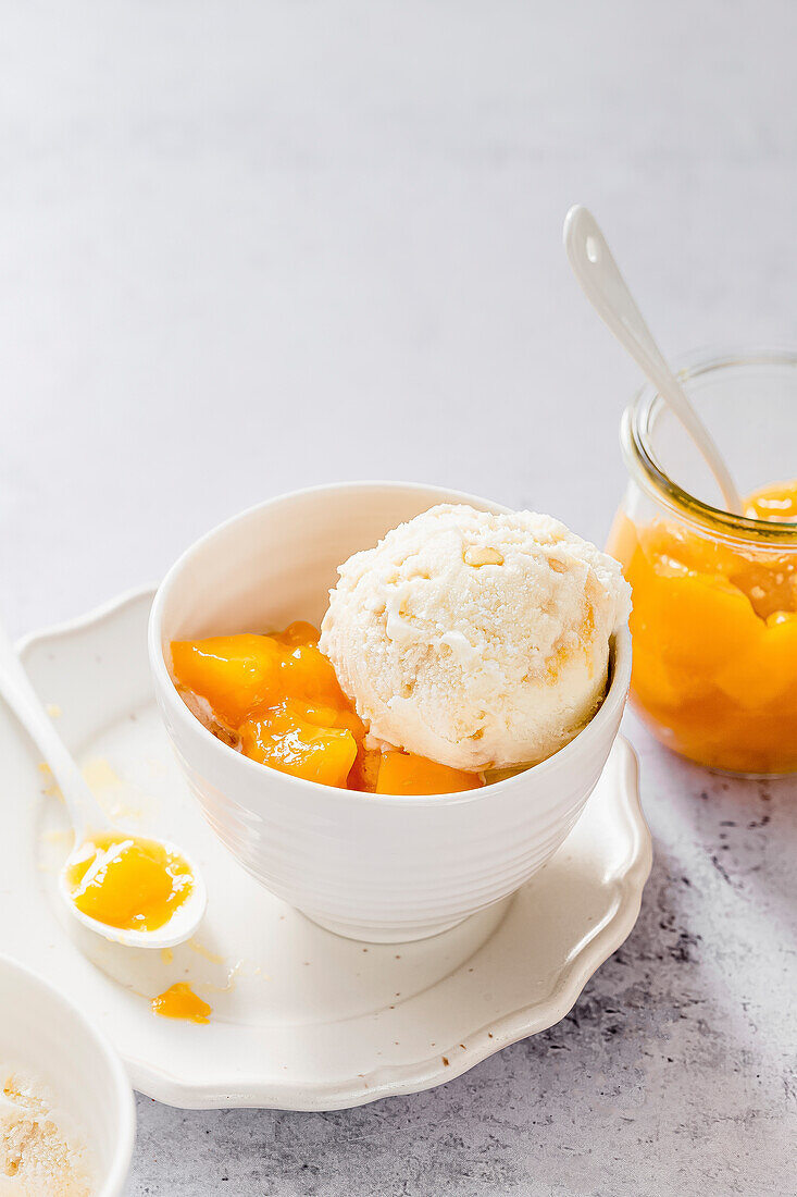 Mango compote served with vanilla ice cream