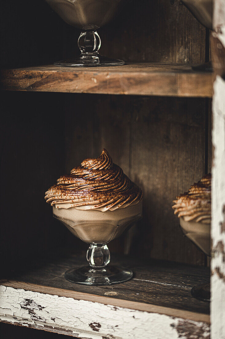 Chocolate and vanilla mousse in a rustic kitchen