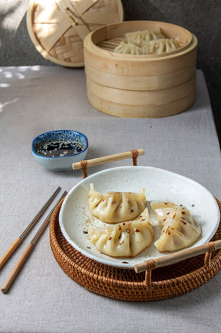 Gyoza Japanese Korean dumplings on a grey plate on the table